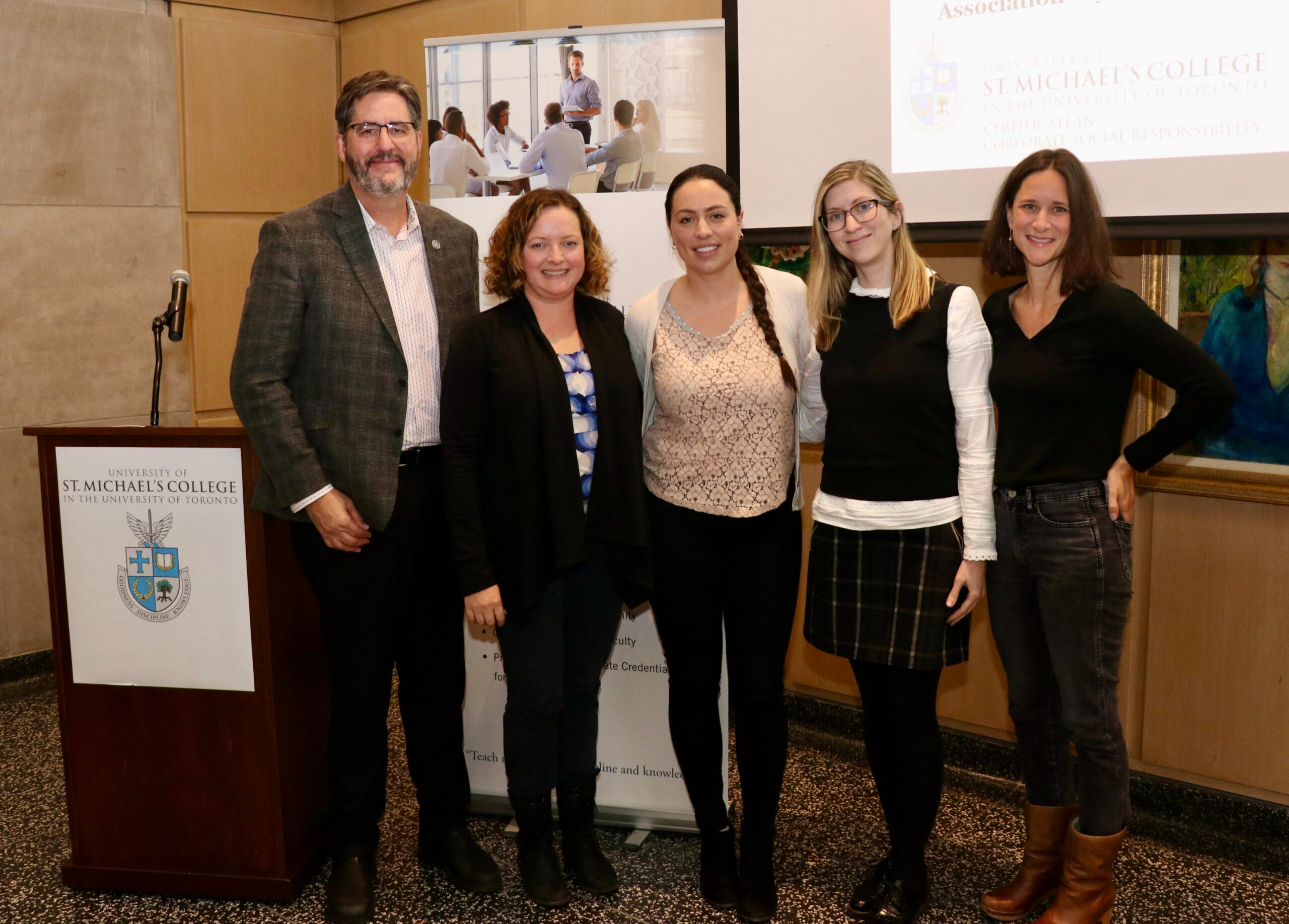 Dr. David Sylvester, President with Winners (centre - Alexandra Biron and Sarah Thirnbeck) and Honourable Mentions (Andrea McLeod and Nikki Byrne) of the President's Capstone Project Award
